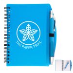 A blue spiral notebook with a pen attached, featuring a logo on the cover and lined pages inside.