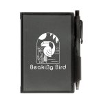 A black Odyssey Pocket Notebook featuring a design with "Beaking Bird" and accompanied by a pen attached to the cover.