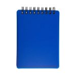 A blue, spiral-bound pocket notebook with a smooth cover and blank pages.