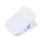 A white magnetic clip with a textured grip and a branded logo. It features a strong spring mechanism for secure holding.