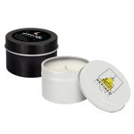 A set of two petite candles in tin containers, one black with a celestial design and the other white with a logo.