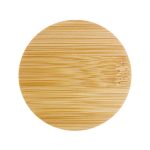 A round bamboo serving board featuring a smooth, natural finish.