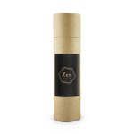 A cylindrical, brown cardboard container with a black label featuring a logo. It is for a vanilla reed diffuser.