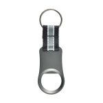 A drink bottle opener in matte grey with a black and white striped strap and a keyring attachment.