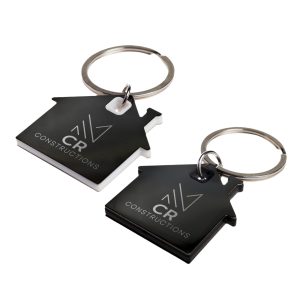 Two house-shaped keytags in black and white, featuring a keyring and a logo on each.