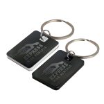A pair of rectangular stainless steel keytags, one black and one white, both attached to key rings.