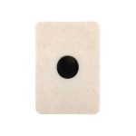 A creamy white magnetic clip with a circular black centre and a smooth, textured surface.