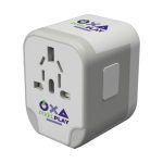 A travel adaptor with multiple plug configurations and branding that reads "OXA PIXELPLAY."