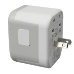 A travel adaptor in white with a compact design and a folding plug. It features multiple ports on one side.