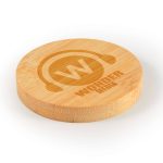 A drink bottle coaster in a round shape made of bamboo, featuring a logo design.