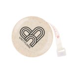 A round, cream-coloured tape measure with a logo and red measurement markings.