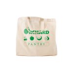 A beige reusable grocery bag with short handles and green branding. Features fruit designs and a logo.