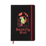A black A5 notebook with a red elastic band, featuring a colorful bird design on the cover and a logo.