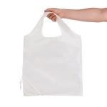 A reusable grocery bag in white, held by a hand, featuring a logo and a foldable design.
