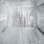 An insulated cooler bag featuring a shiny silver interior. It's spacious with reflective walls.