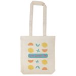 A cream-colored tote bag featuring lemon and tea-themed designs with pastel colors and a logo.