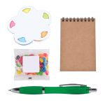 A green pen, a notepad, a flower-shaped sticky note set, and a bag of colorful jelly beans.