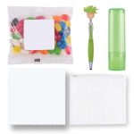 An assortment of colorful jelly beans, a green pen with a character topper, a green lip balm tube, and clear pouches.