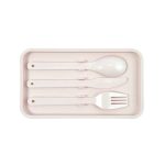 A set of four eco-friendly utensils in a pale pink tray, including a spoon, knife, fork, and a spork.