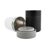 A set of food containers in white, black, and gray, featuring stainless steel interiors and lids.