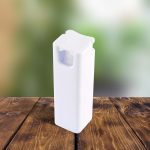 A white spray bottle with a distinctive top, placed on a wooden surface against a blurred background.