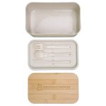 A bamboo lunch box with a clear lid and a removable compartment containing a spoon, fork, and knife.