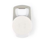 A drink bottle opener phone stand in silver and white, featuring a circular space in the center and a logo.