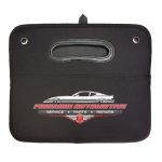 A black cargo storage organiser featuring handles and a logo, designed for automotive use.