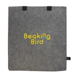 A grey felt tote bag with black handles and a logo prominently displayed in yellow and blue.
