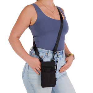 A black neck pouch worn crossbody, featuring multiple pockets, with a model dressed in casual attire.