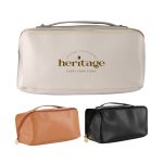 A toiletry bag in beige, with a gold logo, accompanied by orange and black versions. Features a zipper and handle.