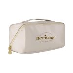A cream toiletry bag with a gold logo, featuring a zip closure and a handle for easy carrying.