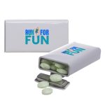 A flip-top tin containing green spearmint mints, with a logo on the container.