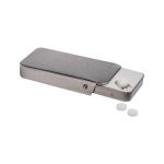 A sleek silver slider tin containing sugar-free breath mints, with a couple of mints beside it.