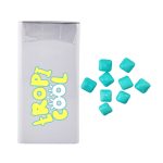 A rectangular pack of mints with a logo, accompanied by turquoise chewy mints scattered around it.