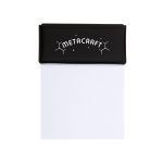 A black memo pad with a textured cover and a white notepad inside. It features a logo on the front.