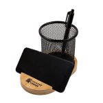 A bamboo phone stand with a black mesh pen holder and a pen included. It features a branded base.