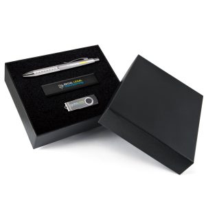A black gift set containing a silver pen, a USB drive, and a black flash drive, presented in a sleek box.