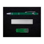A green pen, silver business card holder, and green USB flash drive on a dark background.