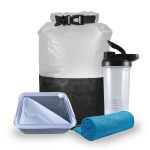 A dry bag, a shaker bottle, a blue microfiber towel, and a lunch container with a fork.