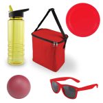 A red cooler bag, yellow drink bottle, red plate, red ball, and red sunglasses arranged together.