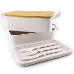 A white lunch container set with a bamboo lid, including a tray and white utensils. The set features a logo.