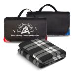 A black and grey checkered picnic blanket, folded with handles and a logo, in a compact form.