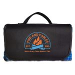 A picnic blanket in black with a logo featuring flames and blue accents. It includes a convenient carrying handle.