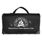 A black picnic blanket with a handle and a logo featuring flames and text.