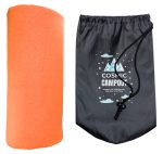 An orange polar blanket next to a drawstring bag with a camping theme and a logo.