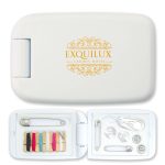 A white sewing kit containing threads, buttons, safety pins, and a needle, with a logo on the exterior.