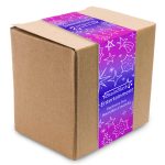 A brown cube box with a colorful purple and pink wrap featuring stars and text on one side.