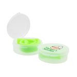 A green silicone straw neatly coiled inside a clear case with a round lid featuring a logo.