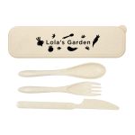 A cutlery set in a cream-coloured case, featuring a spoon, fork, knife, and a logo.